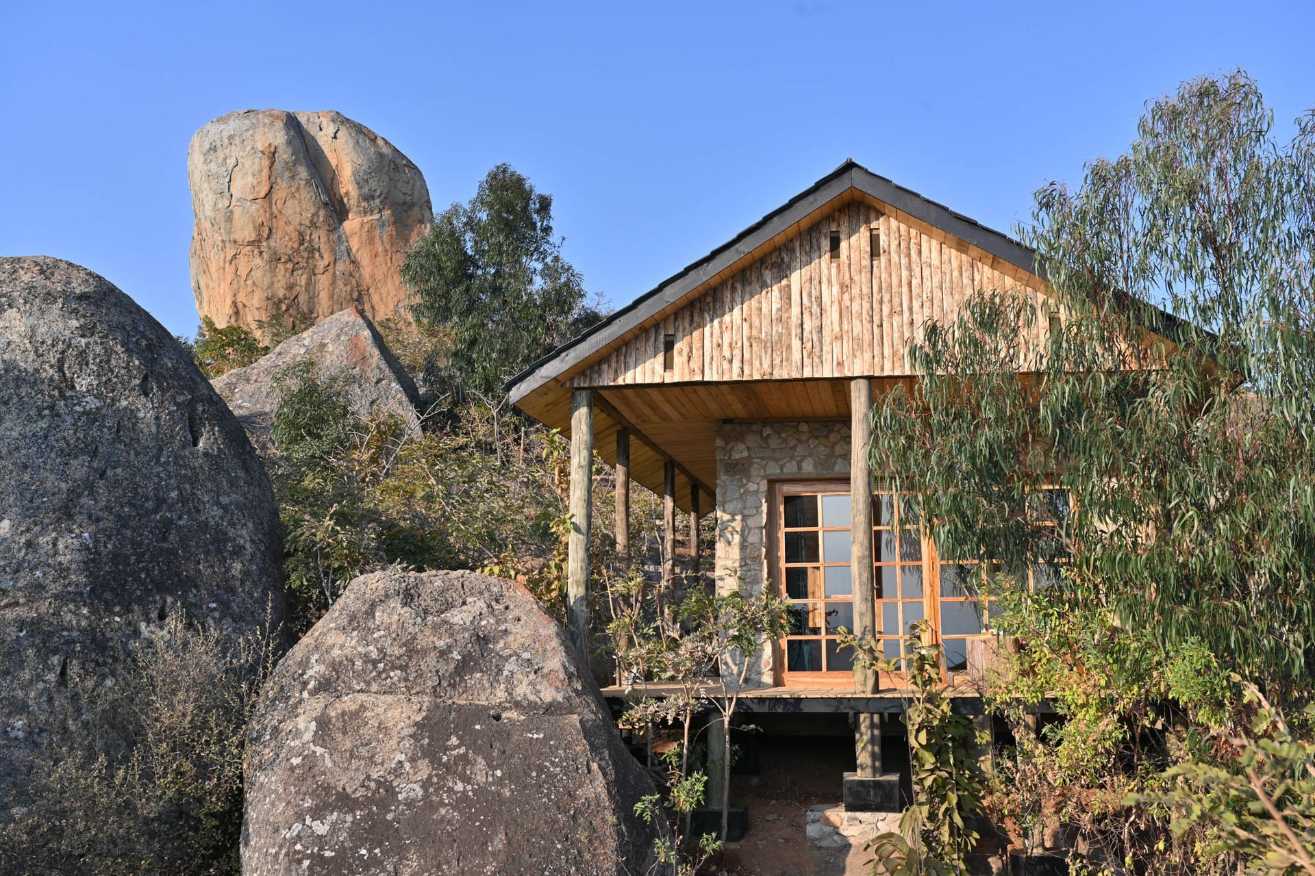 A group of people are riding bicycles down a curvy road.