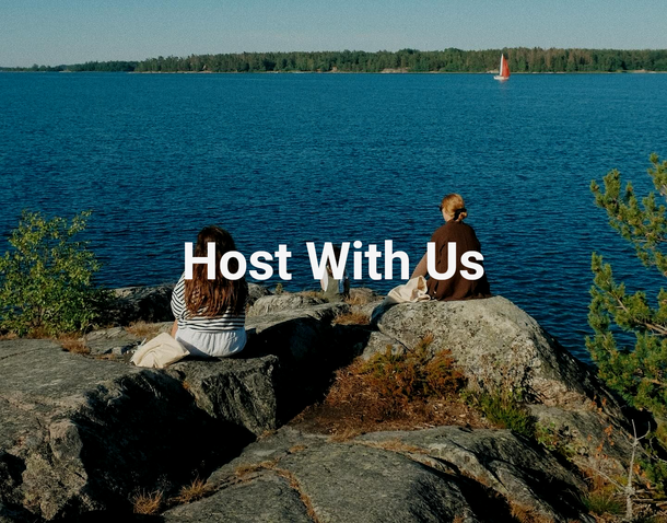 Two people overlooking a lake with