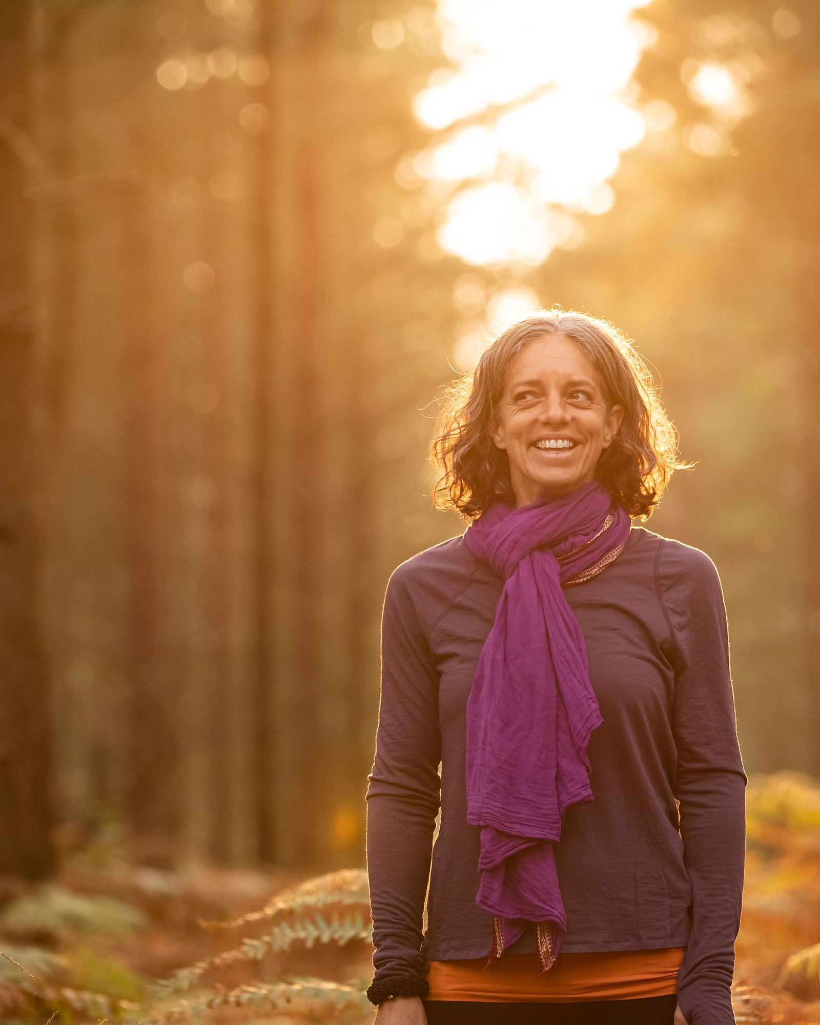Yoga teacher smiling in a shala