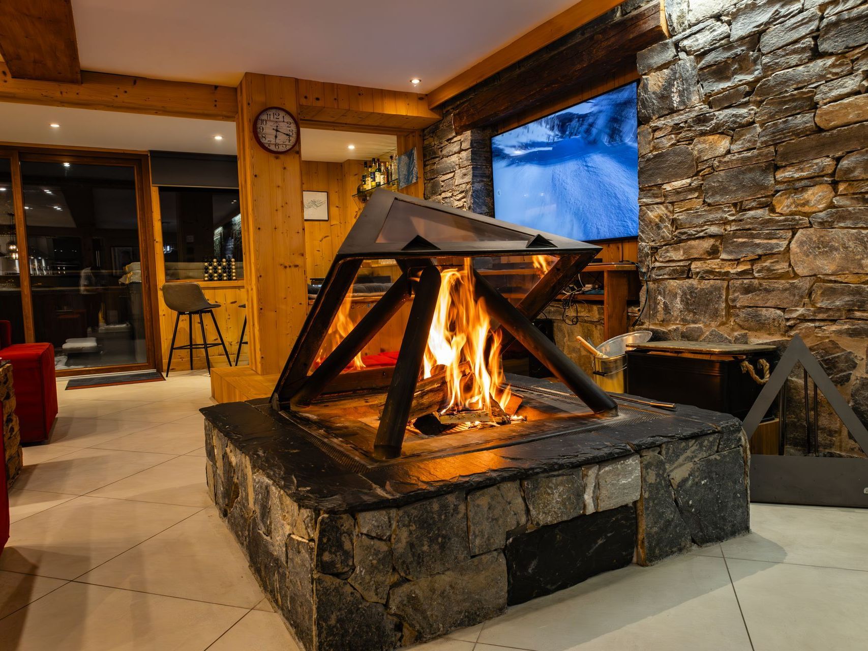 There is a fireplace in the middle of the room.