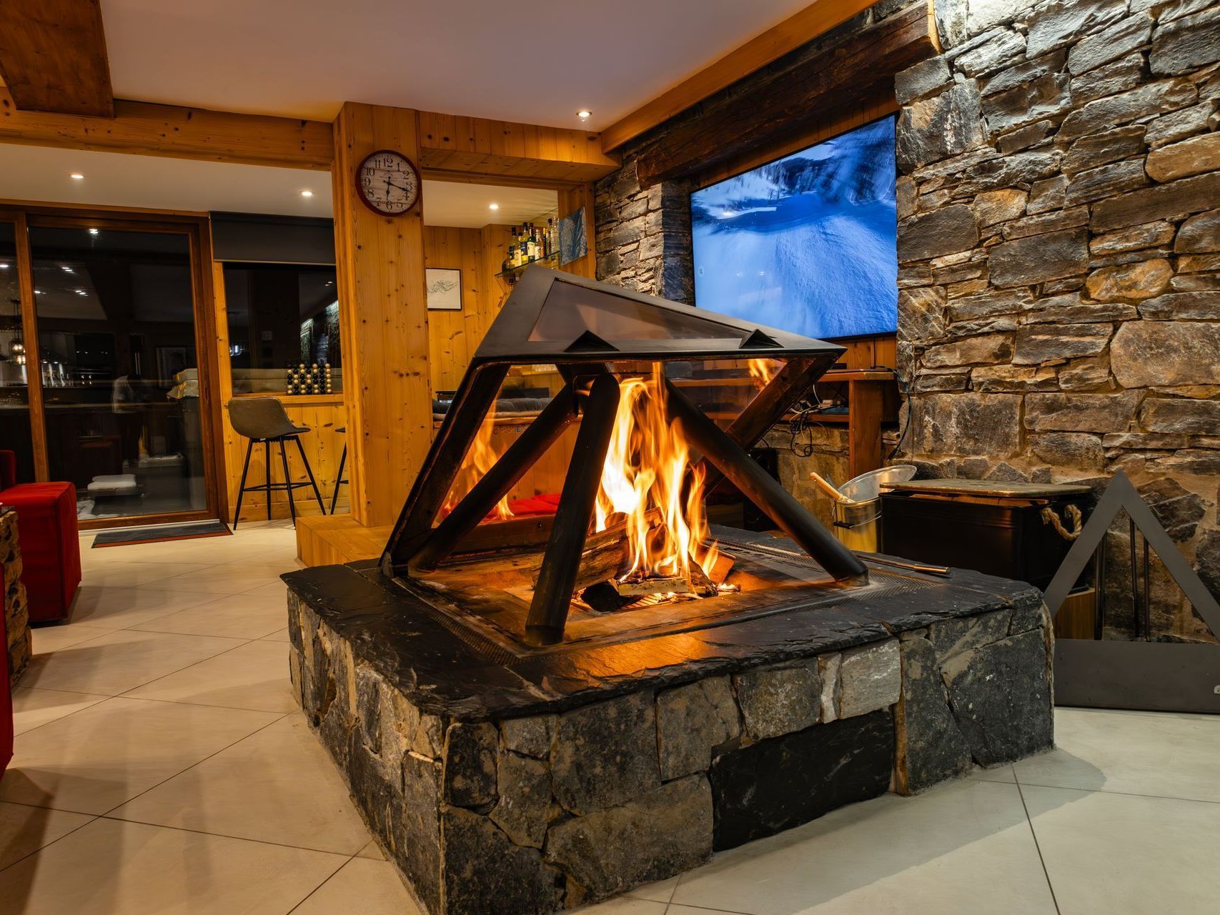There is a fireplace in the middle of the room.