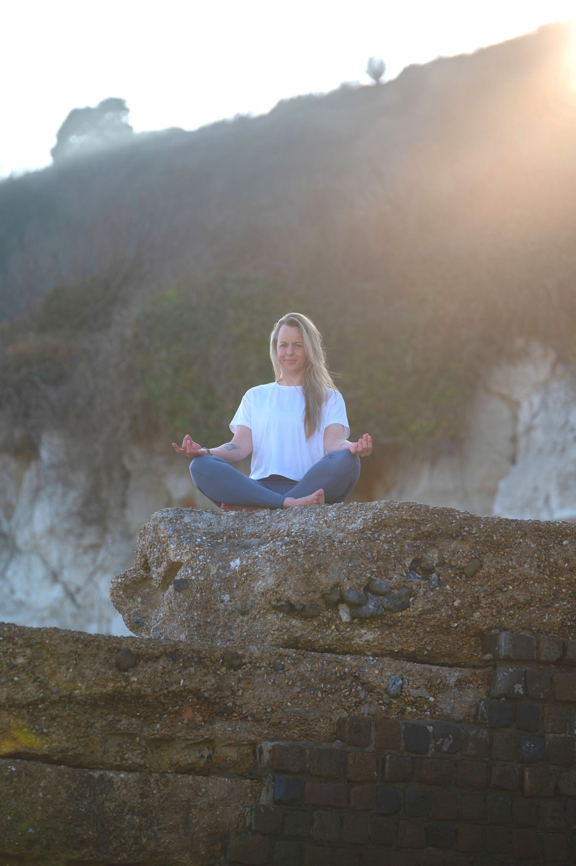Yoga teacher smiling in a shala