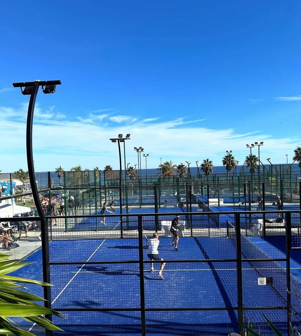 A group of people are riding bikes down a curvy road