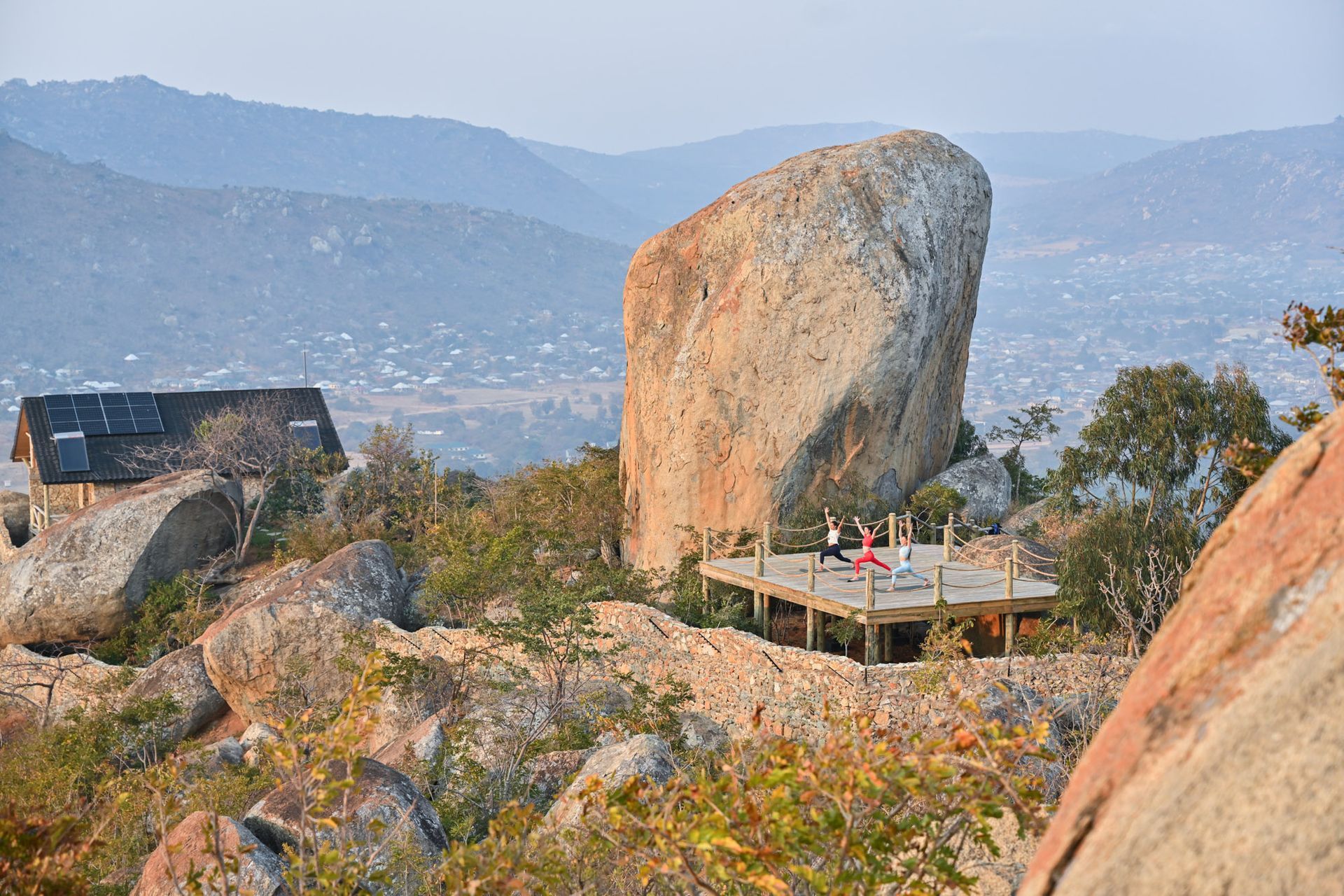 A group of people are riding bicycles down a curvy road.