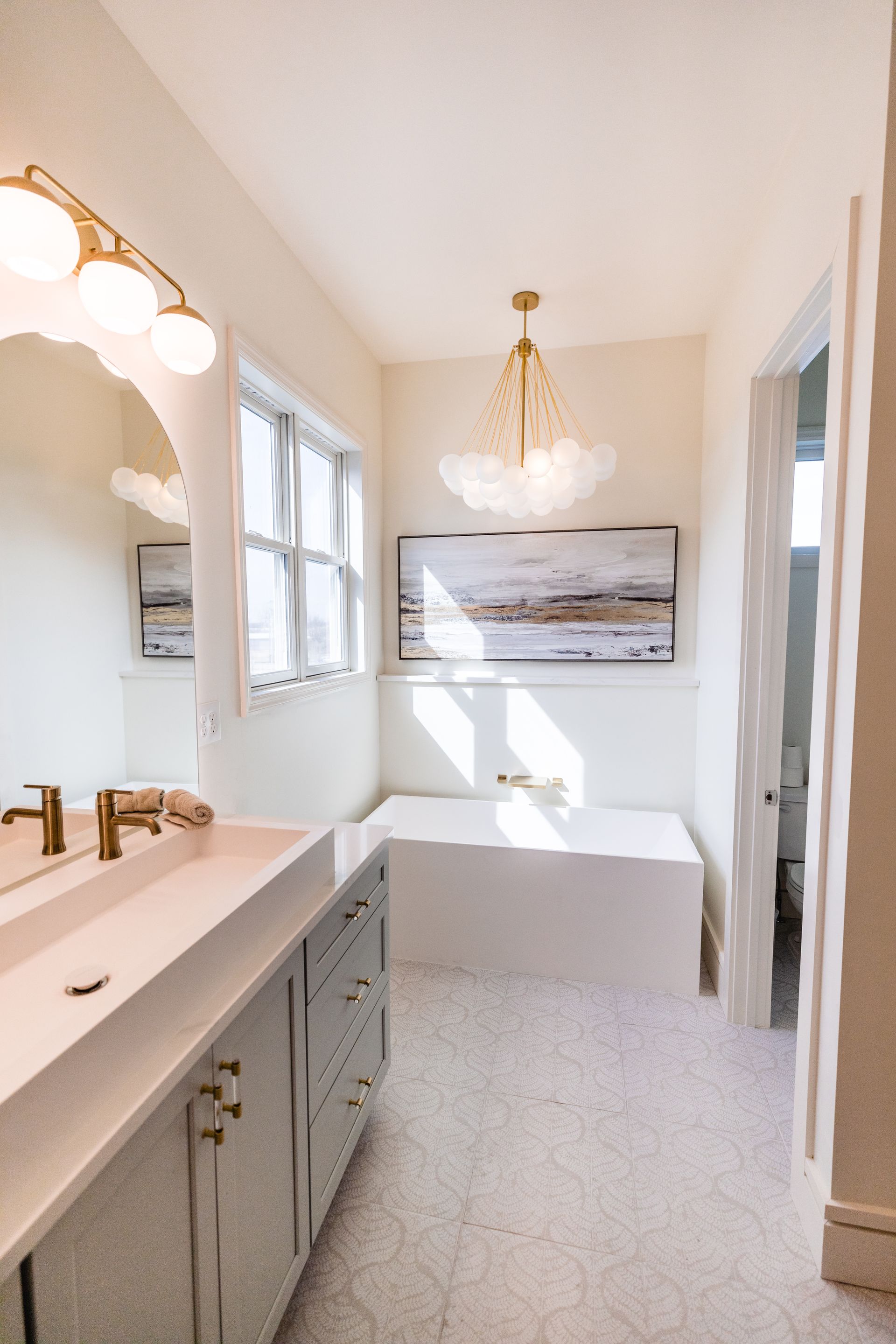 A bathroom with a toilet a sink and a walk in shower