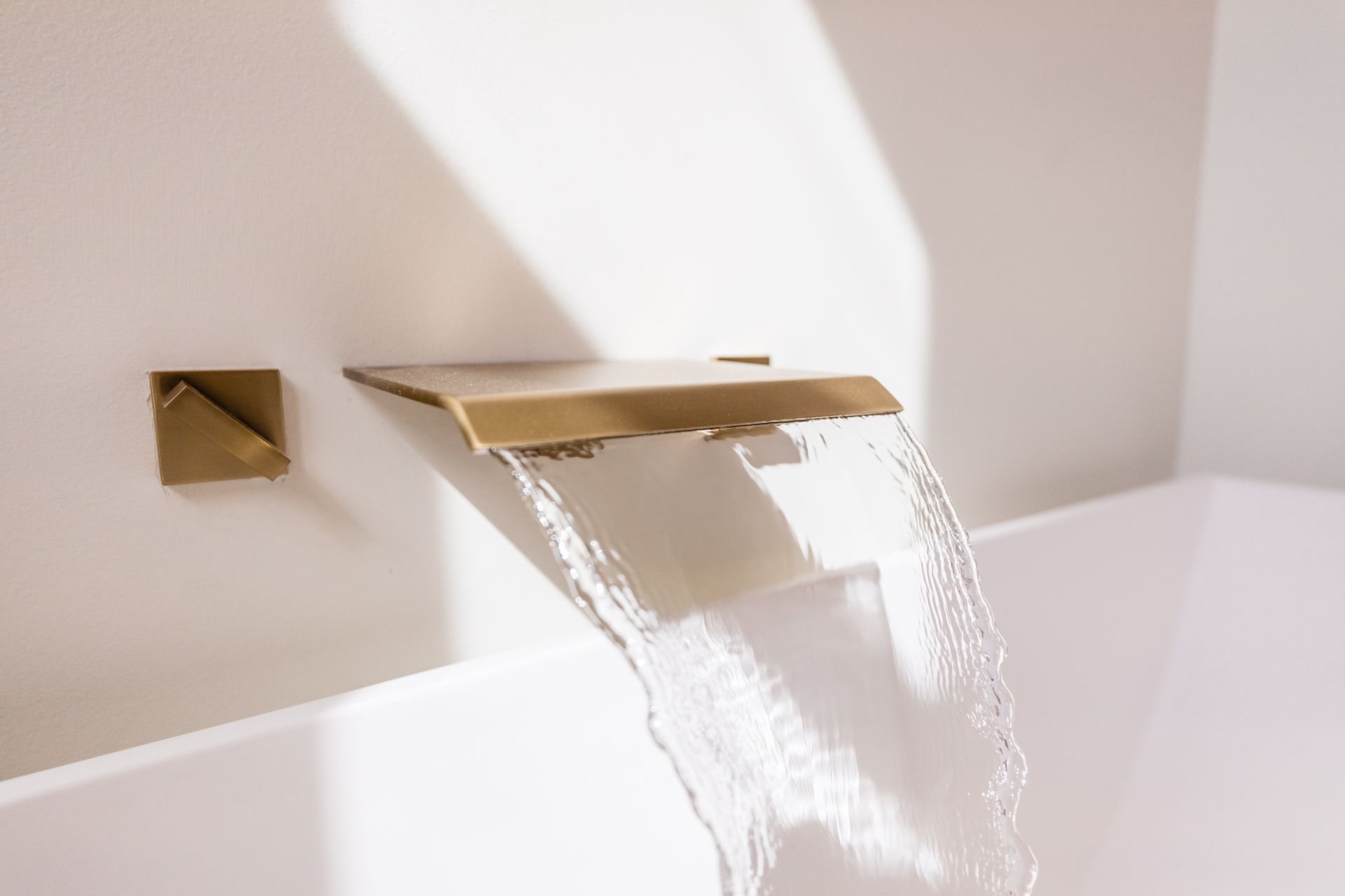 A bathroom with two sinks and a large mirror