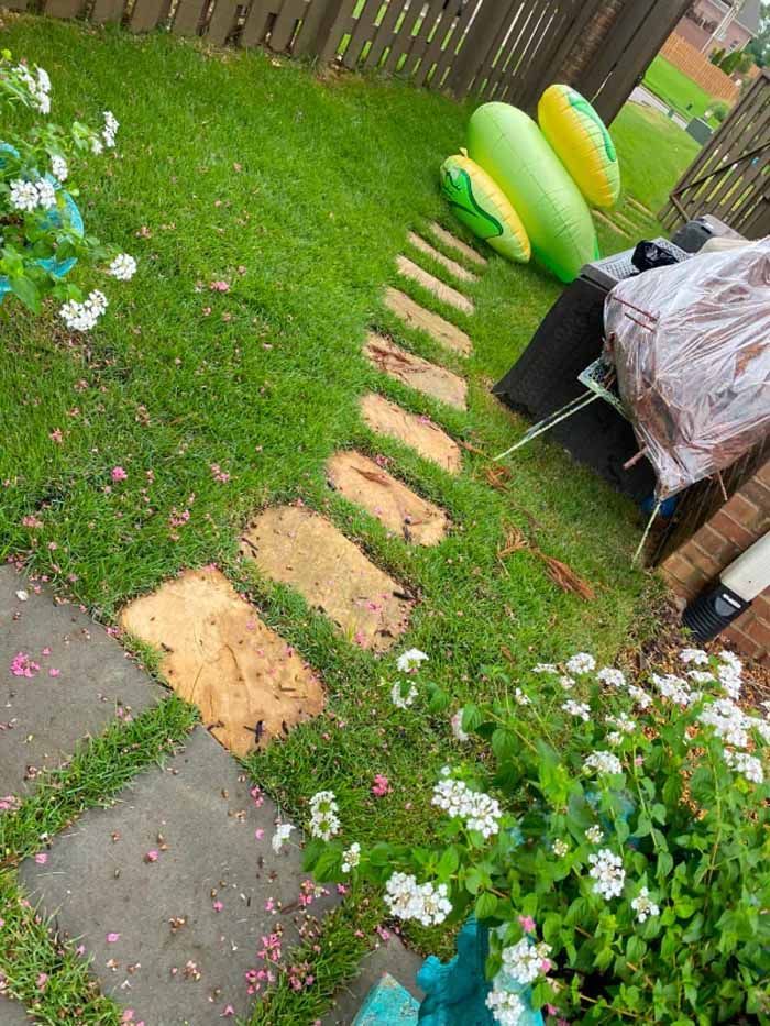 A lawn with a path and a bunch of floats in it.