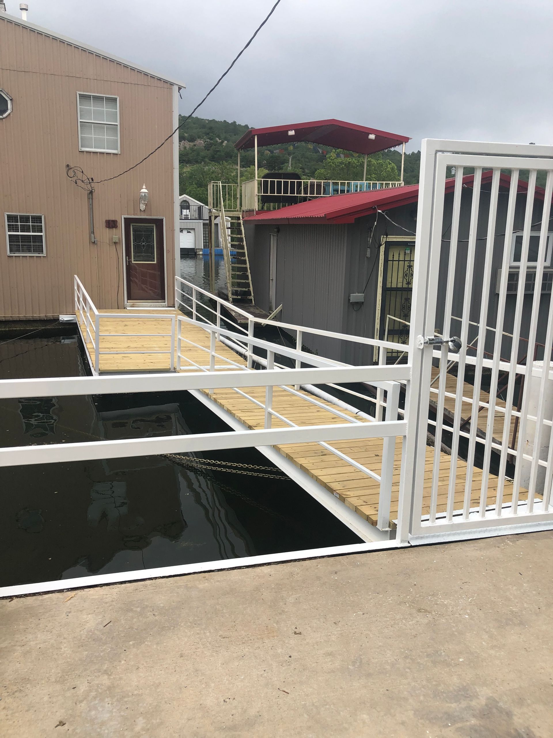 A bridge over a body of water with a building in the background