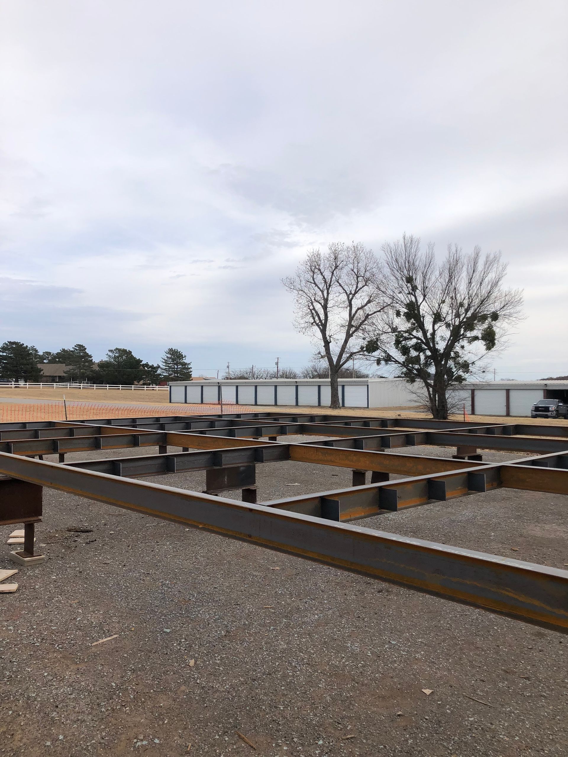 A wooden deck is being built next to a body of water.