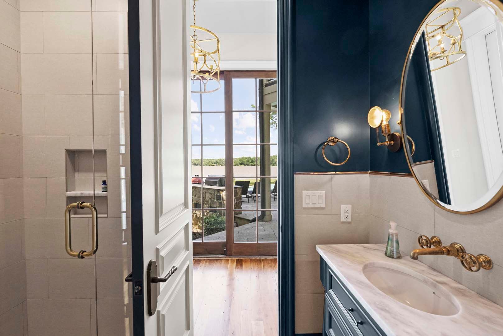 Blue-walled Bathroom With White Counters — Charlotte, NC — Harland Building Group