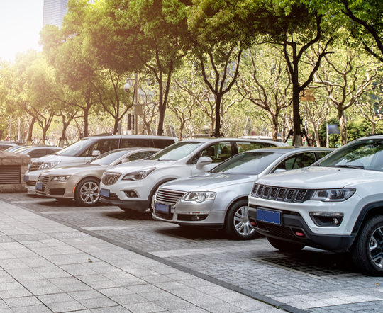 Rows of Vehicles Parked Outside