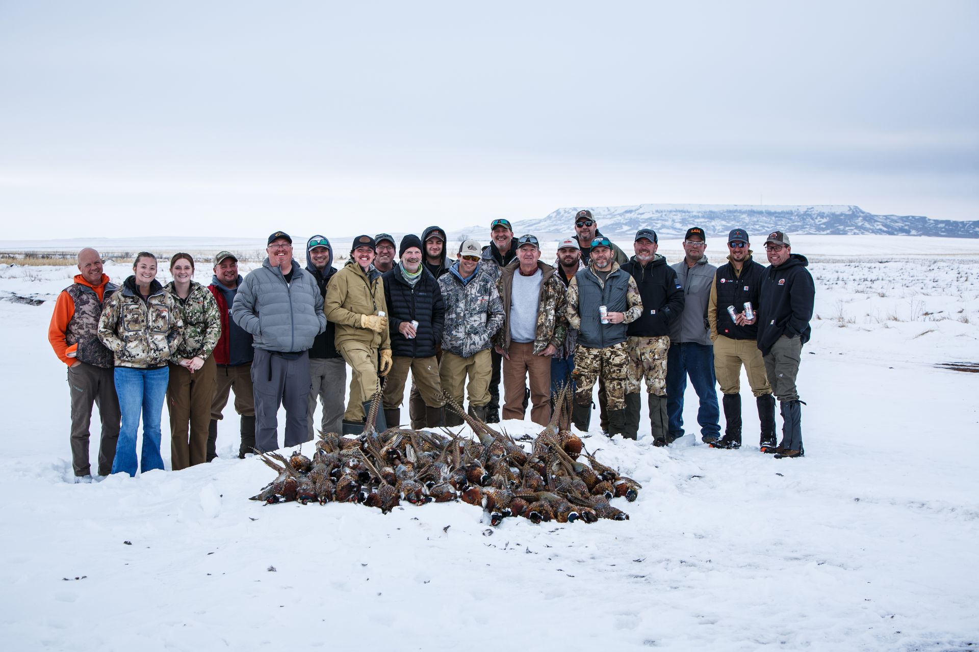 A group of people are posing for a picture in the snow.