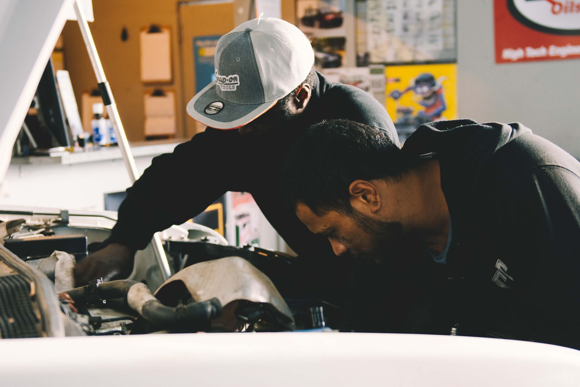 Two Men Doing A Car Service in Geelong