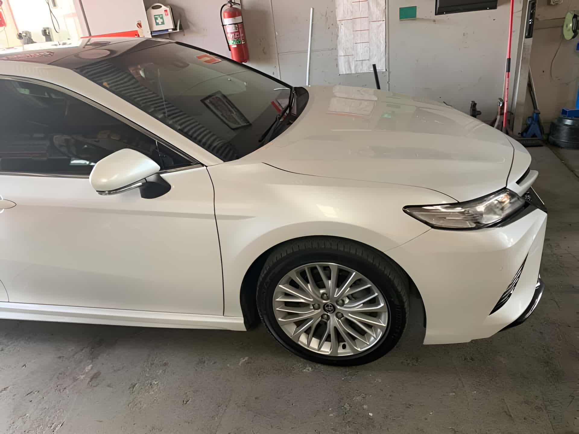 A White Car Is Parked In A Garage — North Geelong Automotive In North Geelong, VIC
