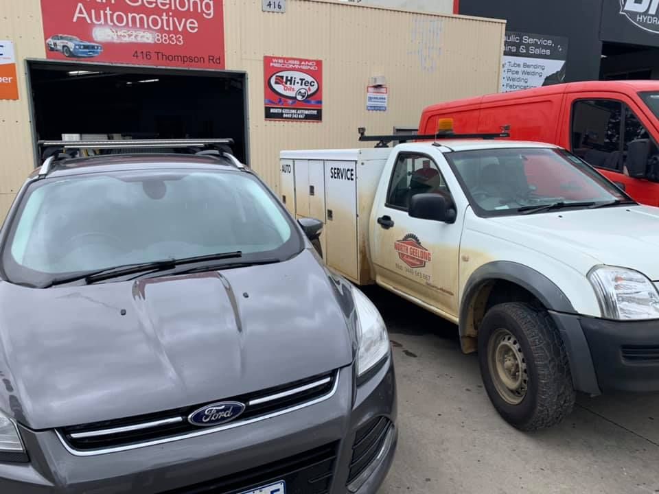 Two Cars Are Parked In Front Of An Automotive Shop — North Geelong Automotive In North Geelong, VIC