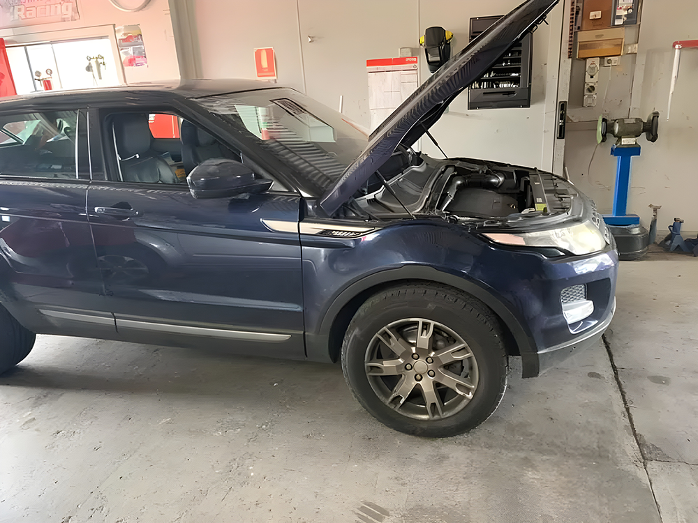 Blue Car Open Hood Garage