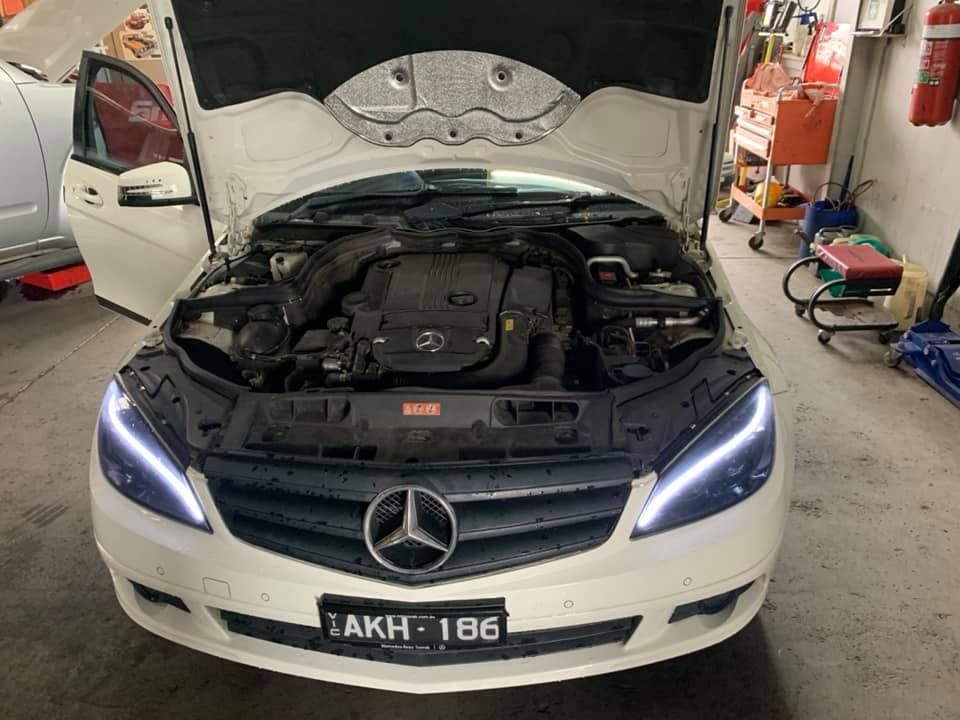 Car With Open Hood in a Garage — North Geelong Automotive In North Geelong, VIC