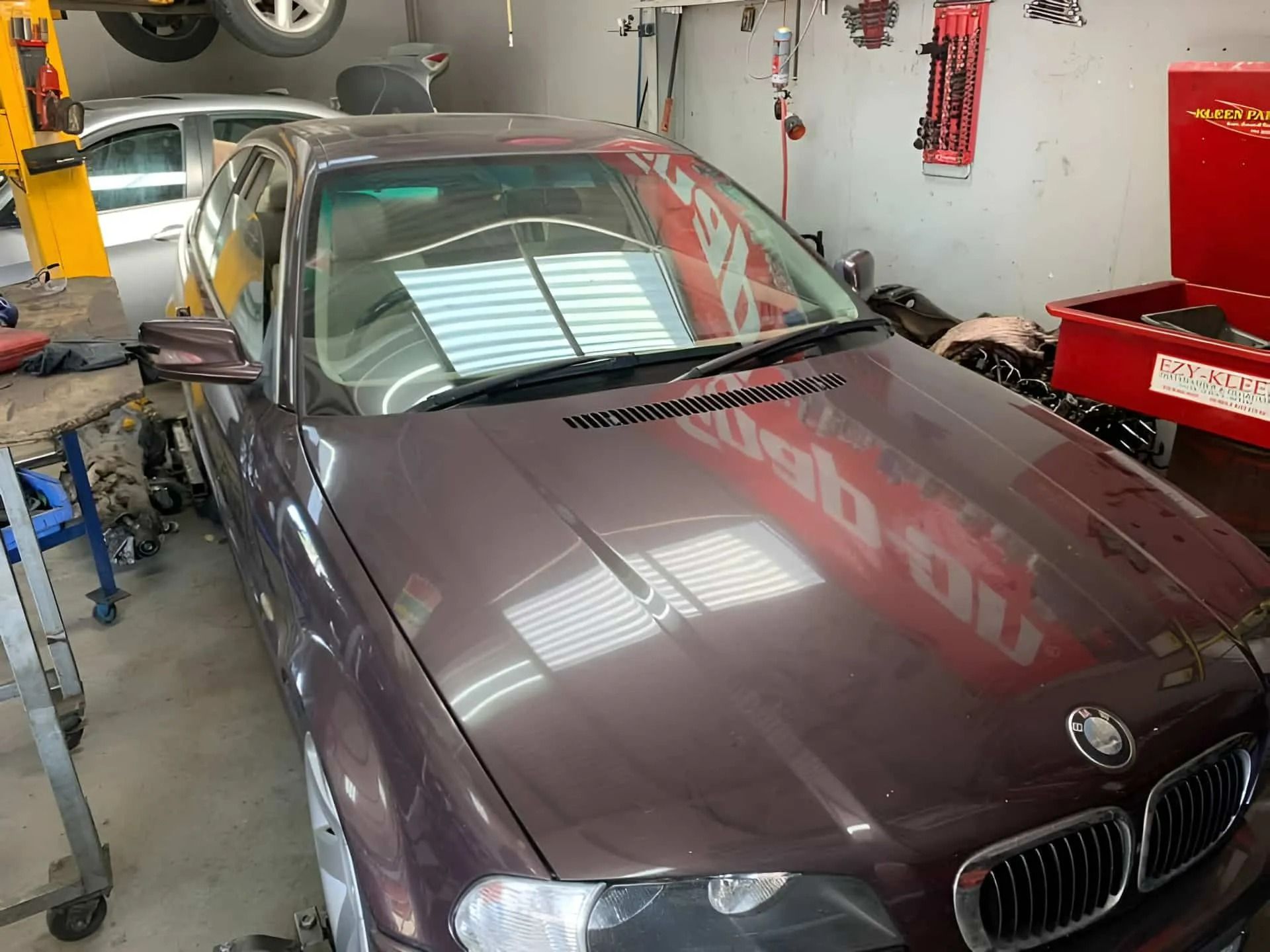 Maroon BMW In Geelong Repair Garage