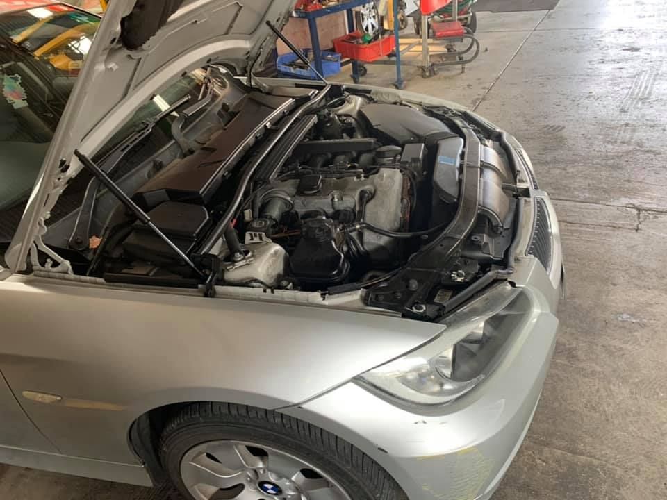 Silver Car With Open Hood in Garage — Ready for car servicing in Geelong