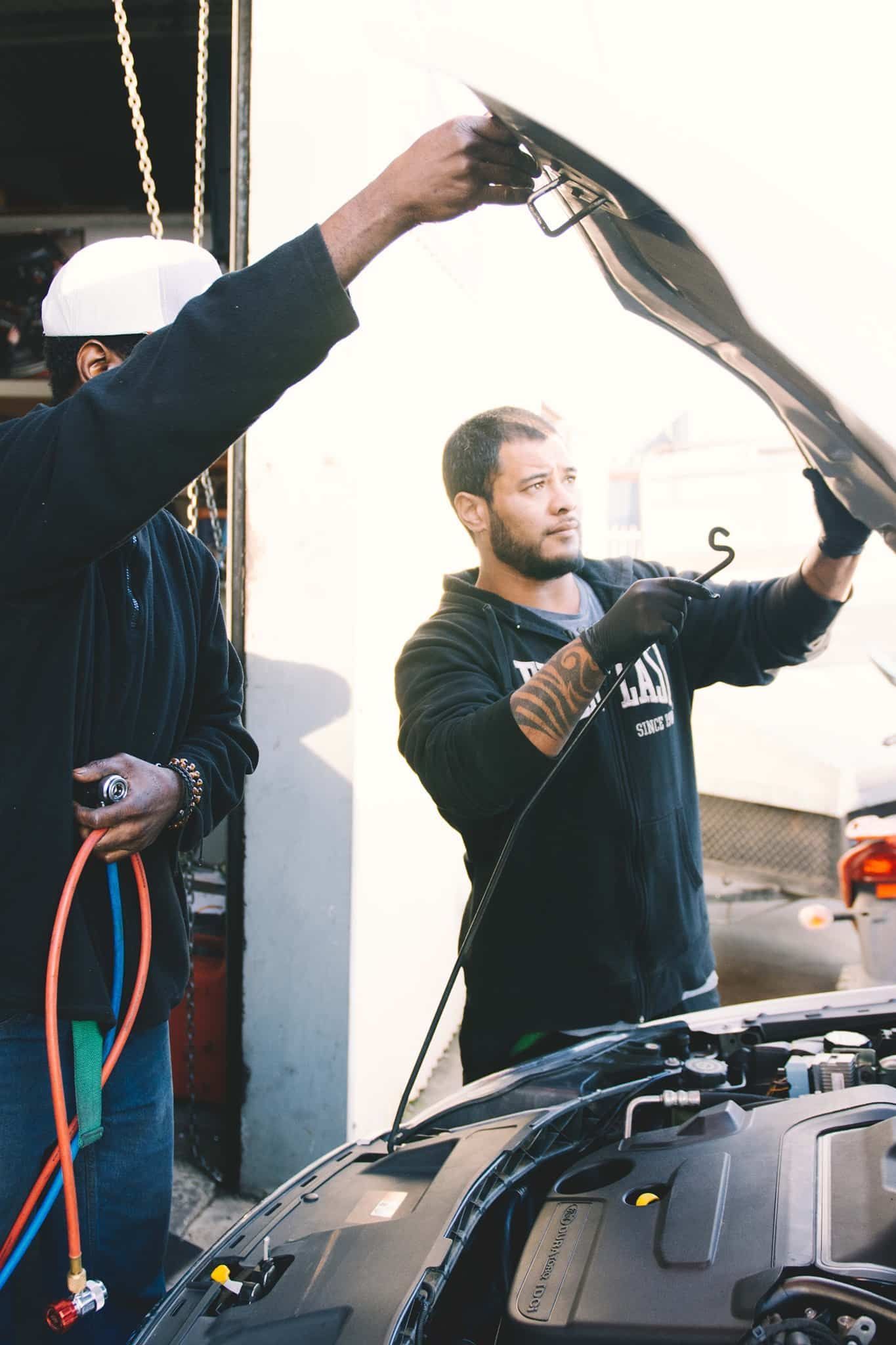 Two Men Are Working On A Car With The Hood Open — North Geelong Automotive In North Geelong, VIC