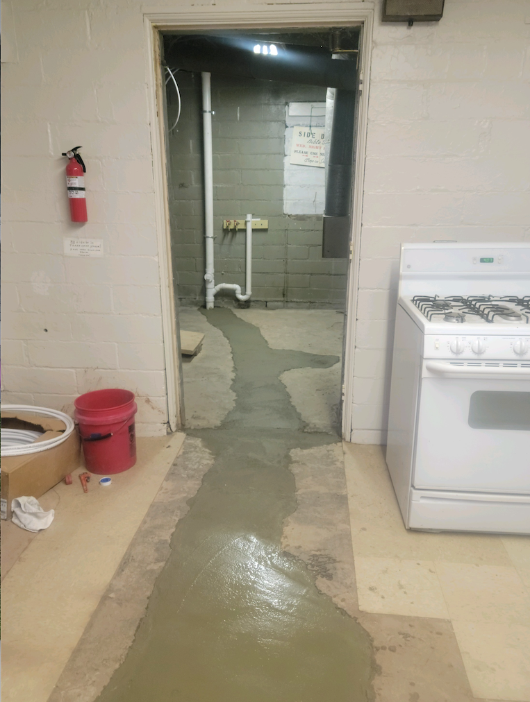 New concrete floor over new sewer drain