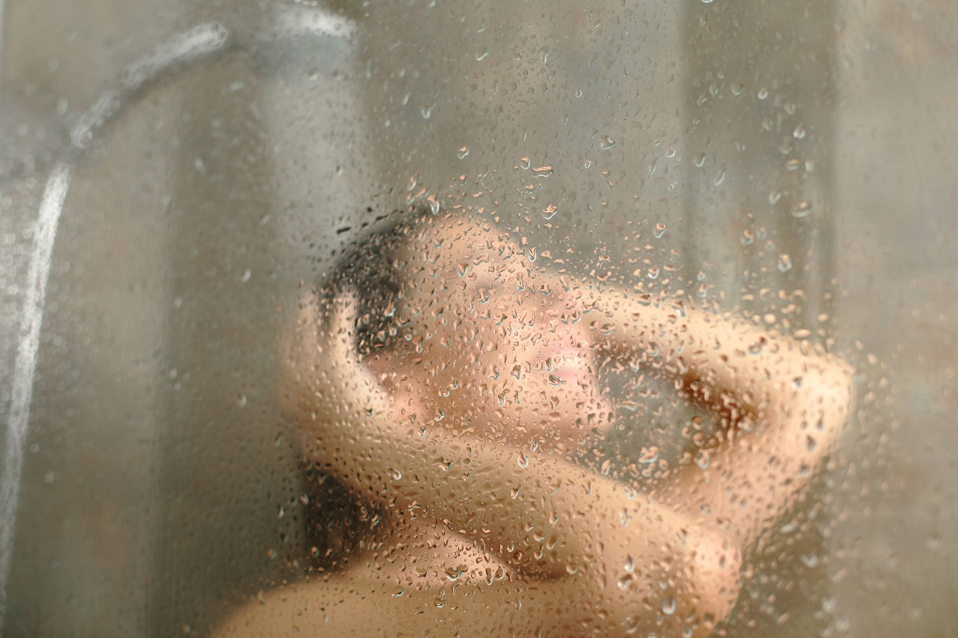 Woman taking a hot shower.