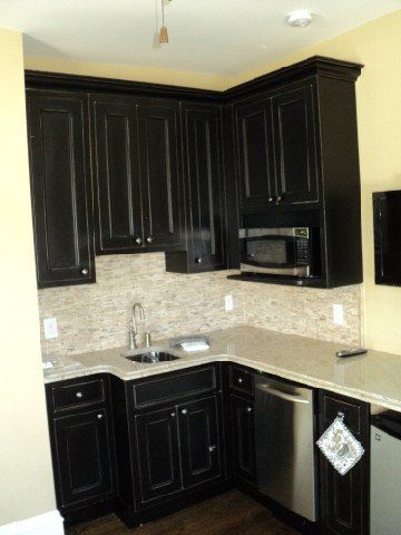 Kitchen with Black Cabinet — Cape May County, NJ — Quality Home Center