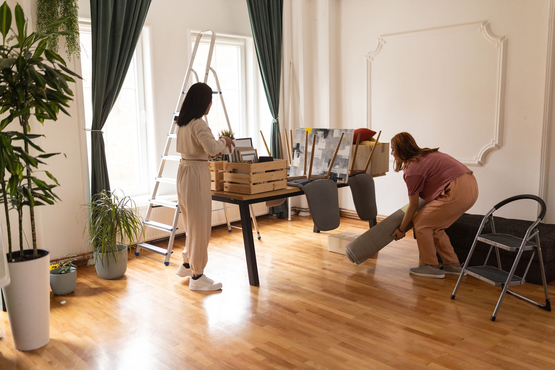 Two women are moving into a new apartment.