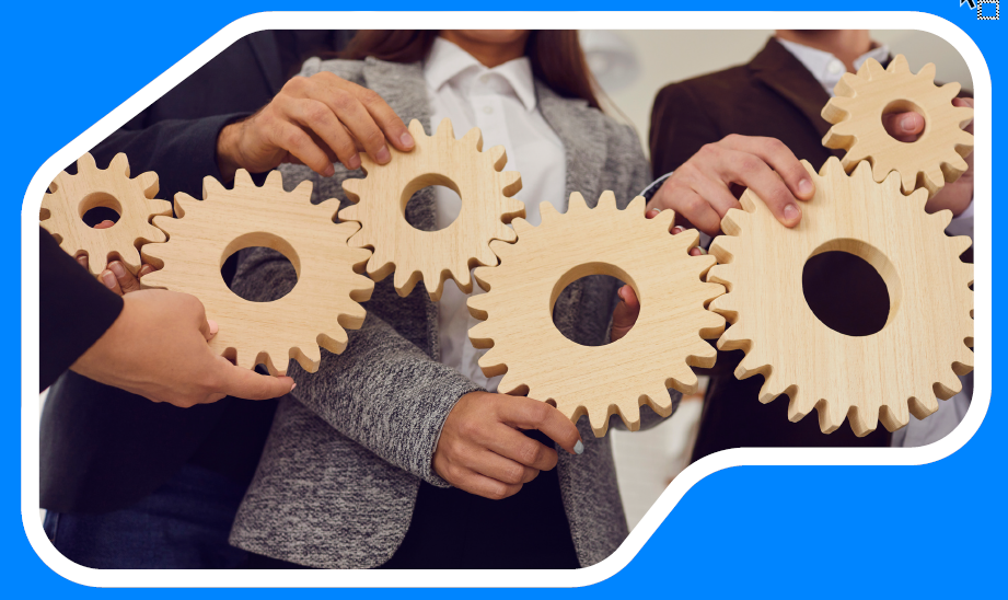 A group of people are holding wooden gears in their hands