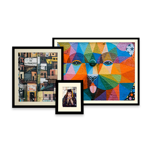Three framed pictures are sitting next to each other on a white background.