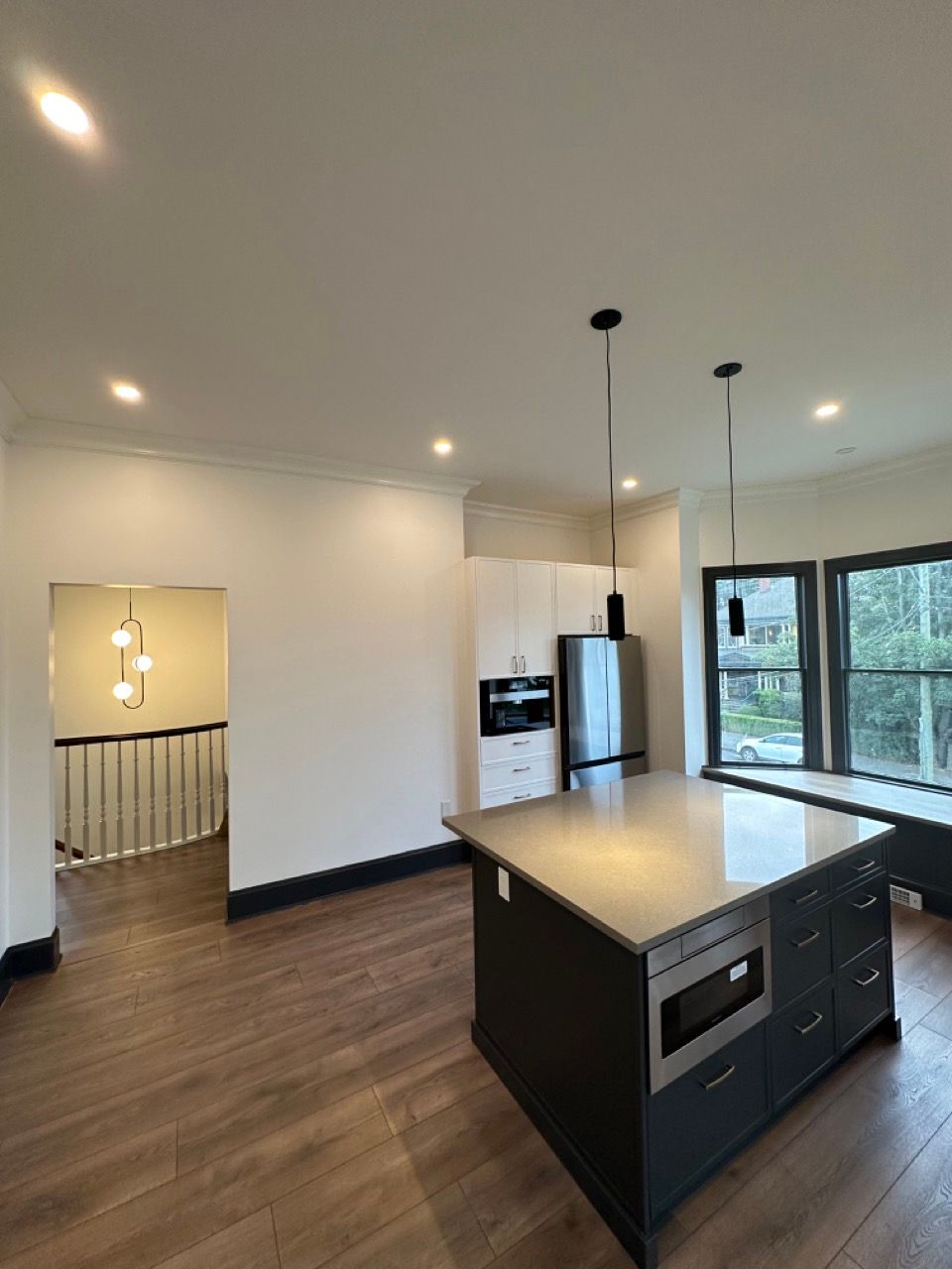 There is a large island in the middle of the kitchen.