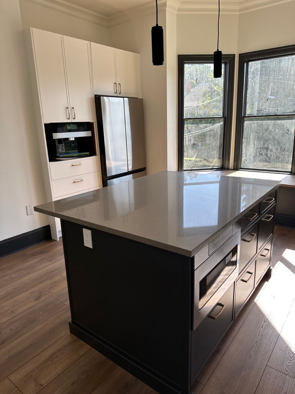 A kitchen with a large island in the middle of the room.