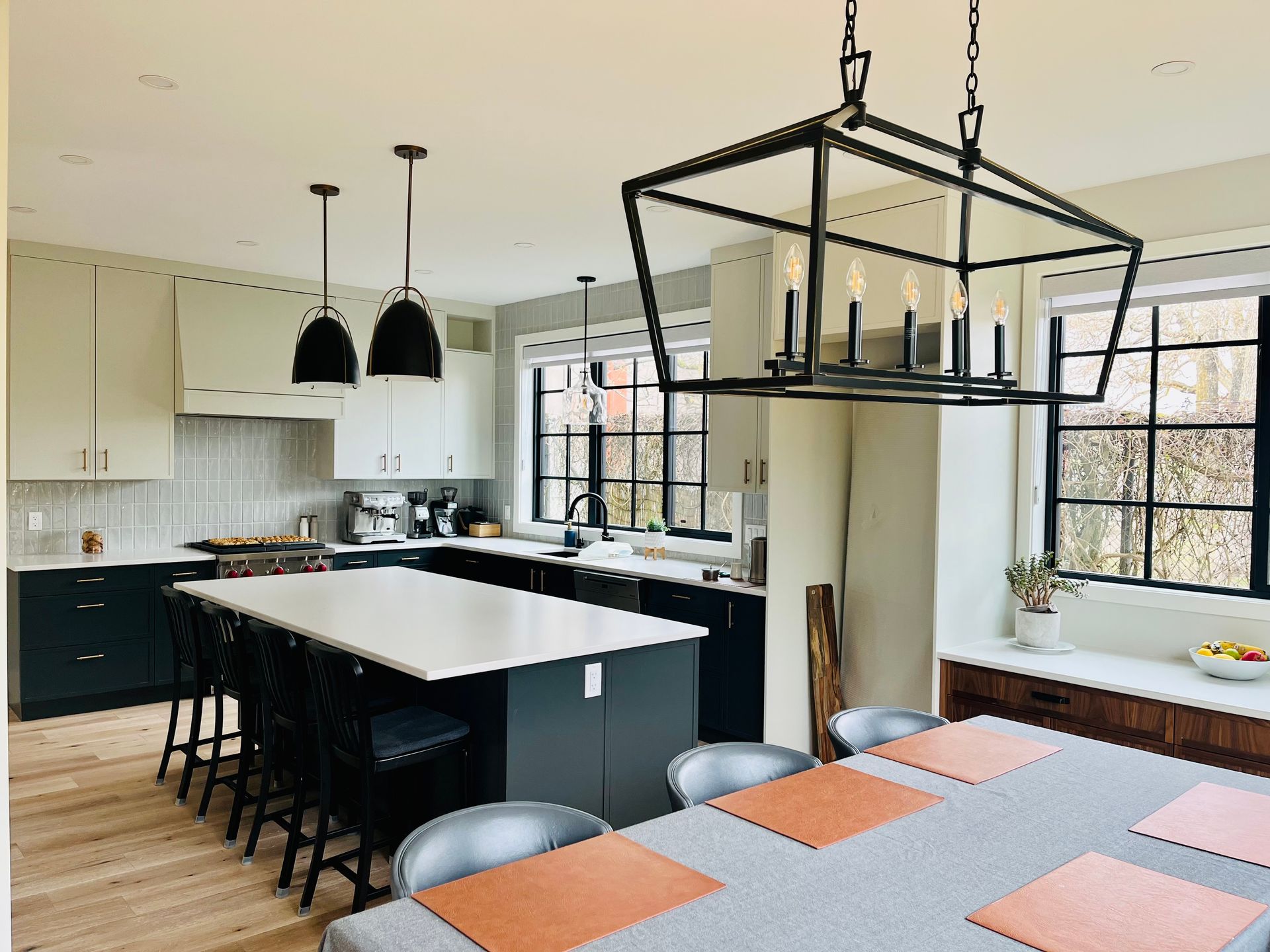A kitchen with a large island and a dining table