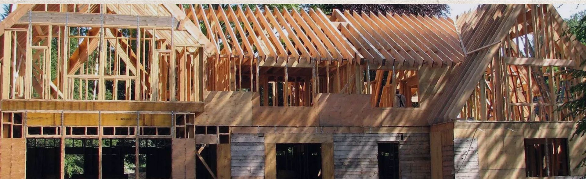 A house is being built with a lot of wooden beams - Construction
