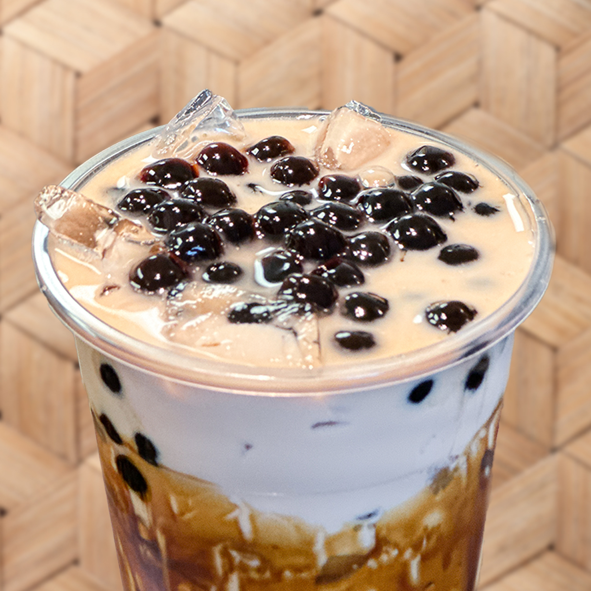 A close up of a drink with bubbles on top