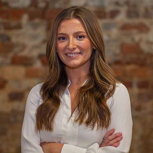 Gray silhouette of a person inside a rounded-square, gray background.