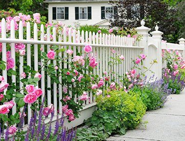 Fences and Gates — White Fence Surrounded with Flowers in Southeast Everett, WA