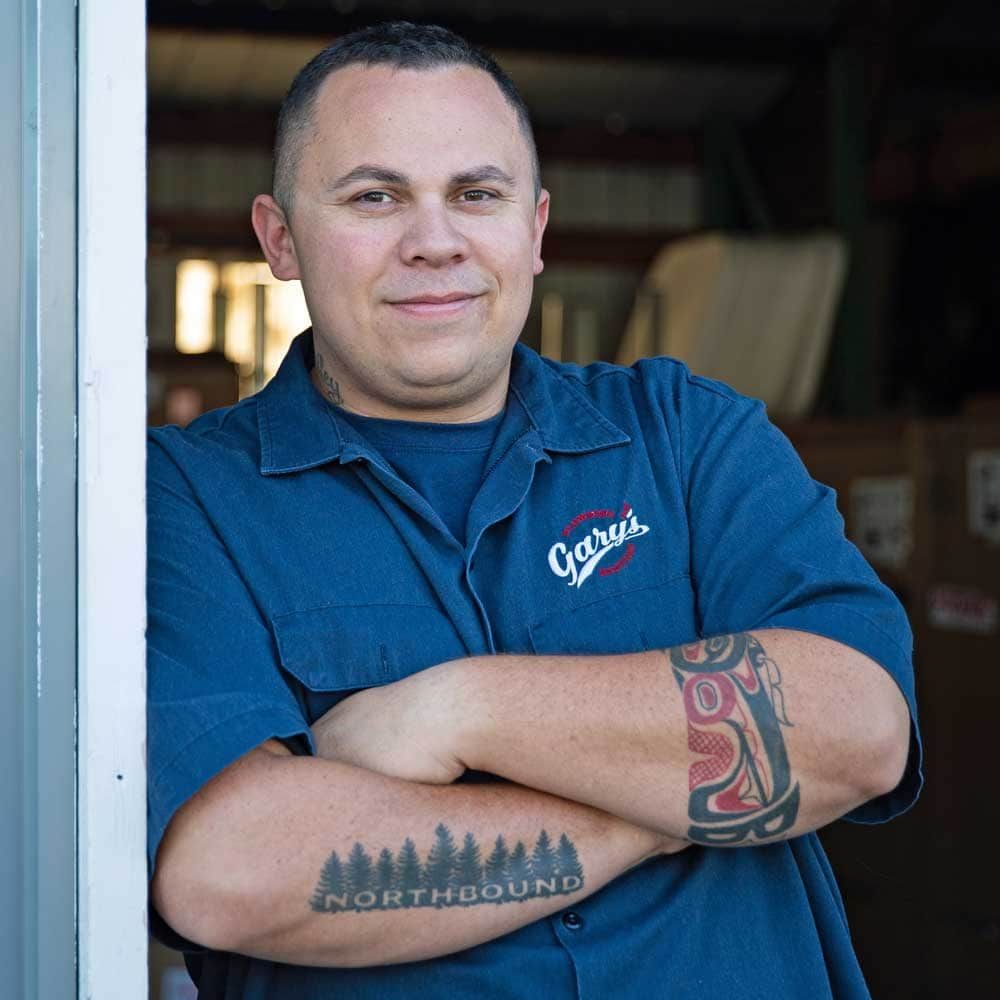 A man with a tattoo on his arm that says northbound