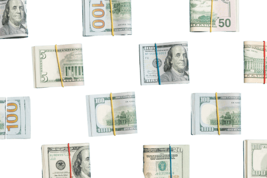 A bunch of stacks of money tied together with rubber bands on a white background.