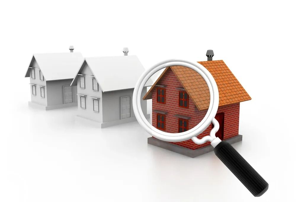 A magnifying glass is looking at a row of houses.
