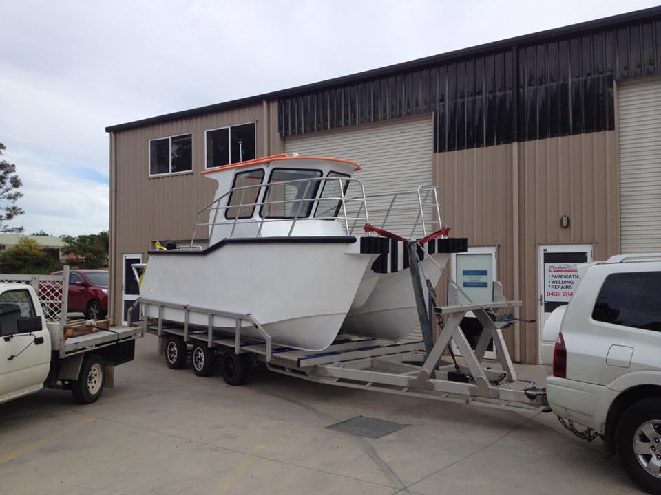 catamaran sitting on top of trailer