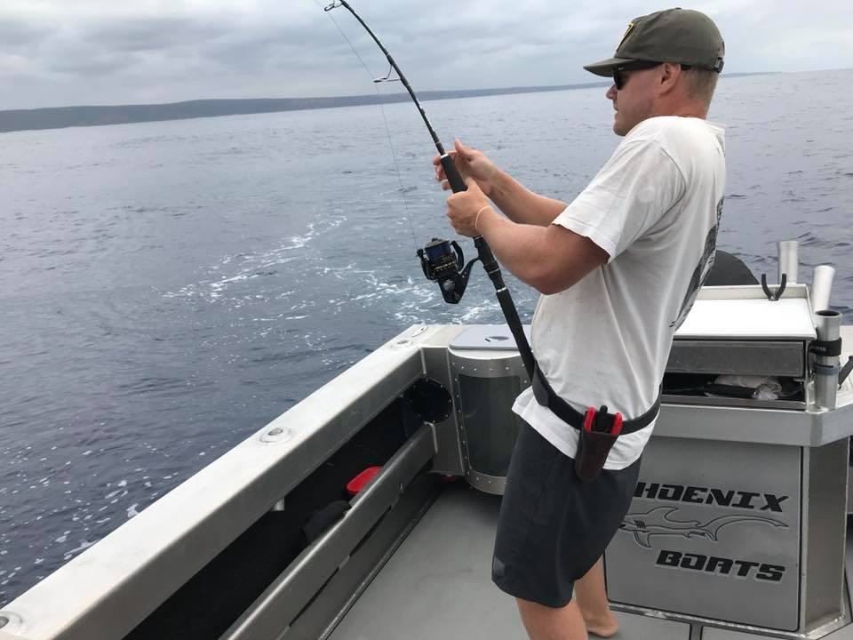 man fishing on a boat