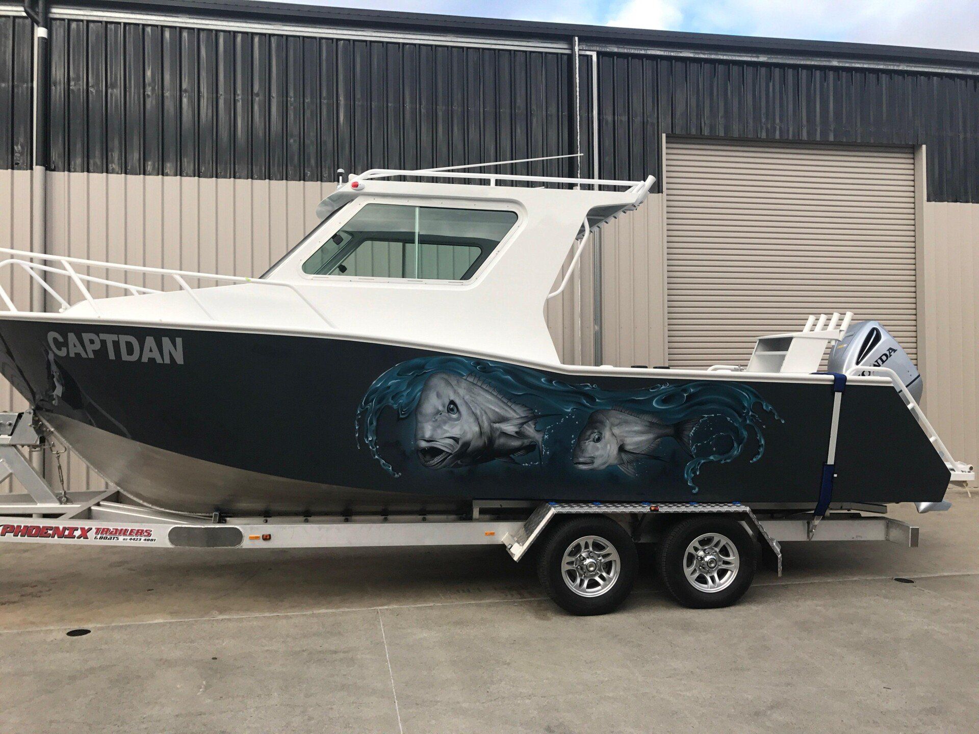 7.5 cabin boat pulling by a trailer