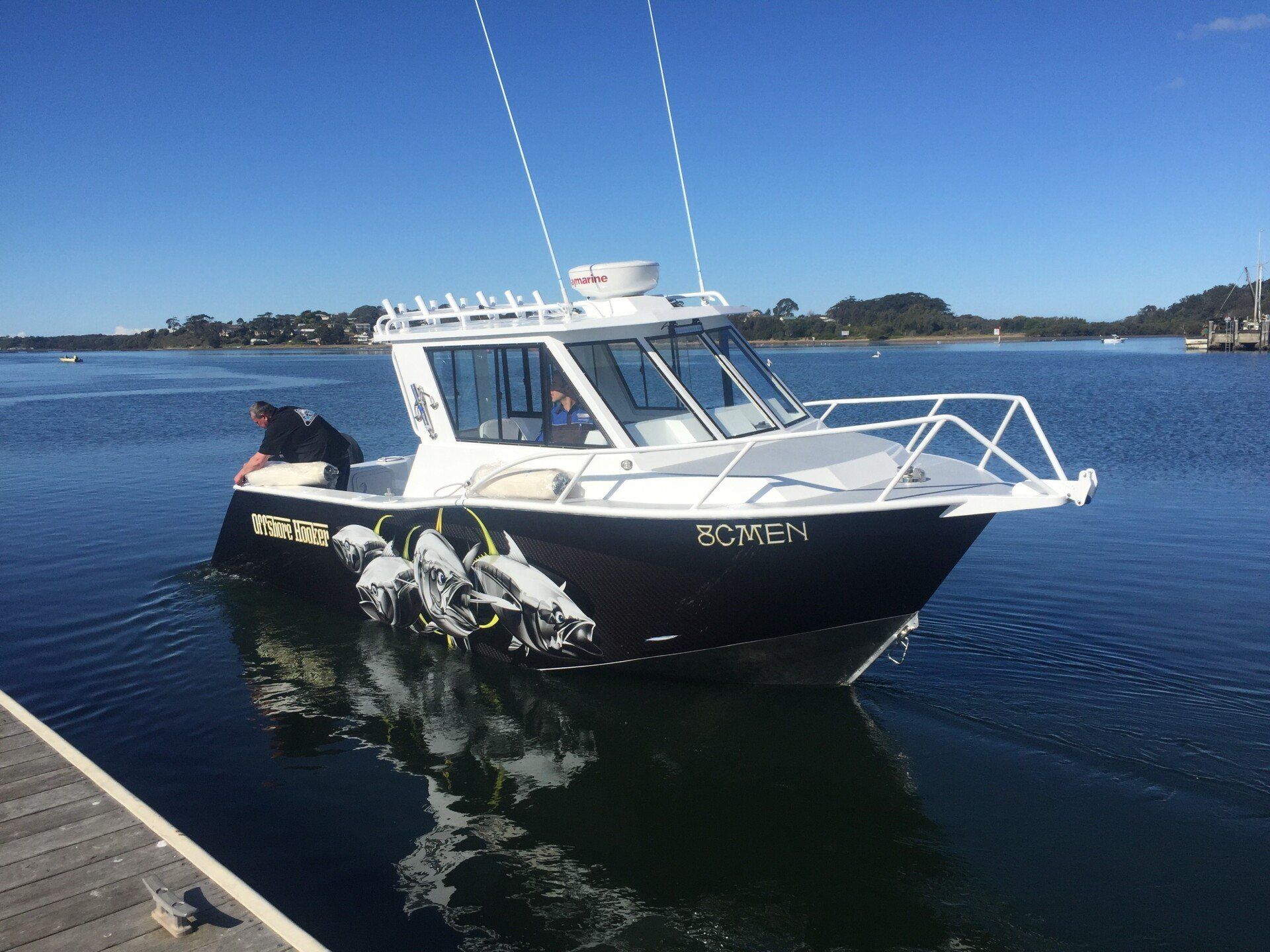 7.7 fishing cabin boat on a lake