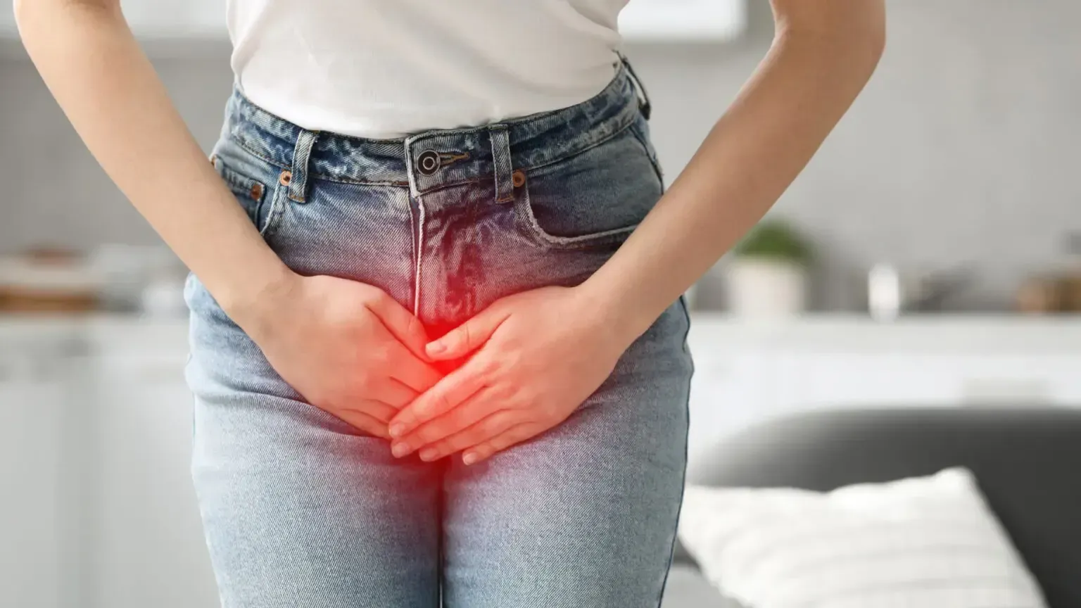 Woman smiling with eyes closed, enjoying the sun with blue sky background.