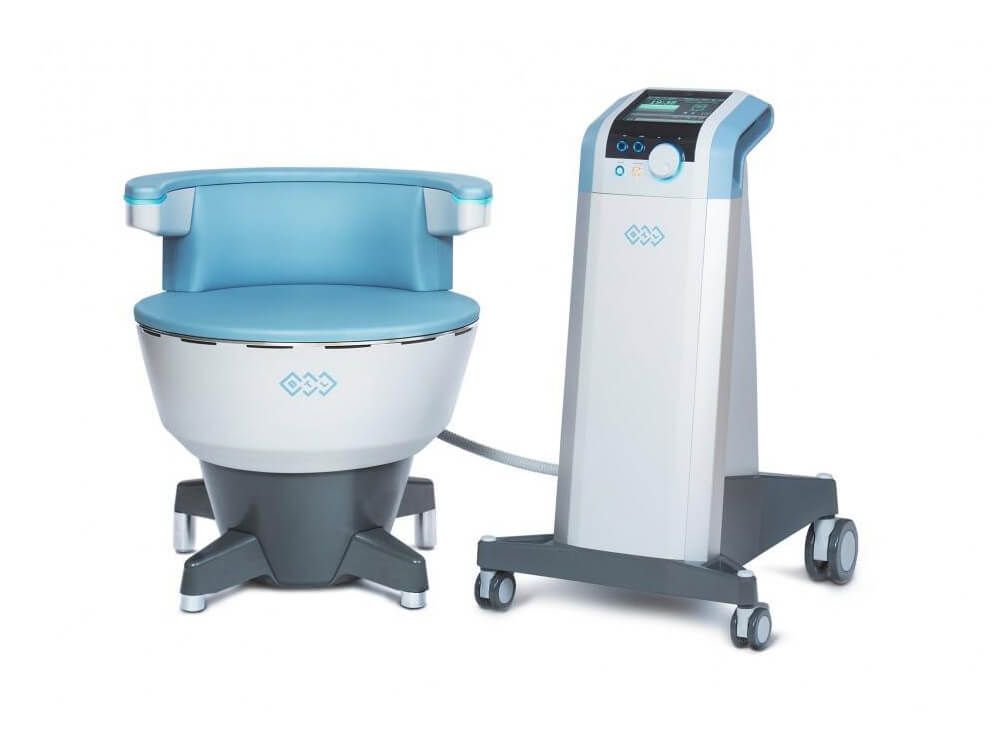 White recliner chair in a bright room with plants, next to a window with sunlight.