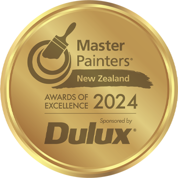 Golden emblem for Master Painters New Zealand Awards of Excellence 2024, sponsored by Dulux; features paintbrush icon.