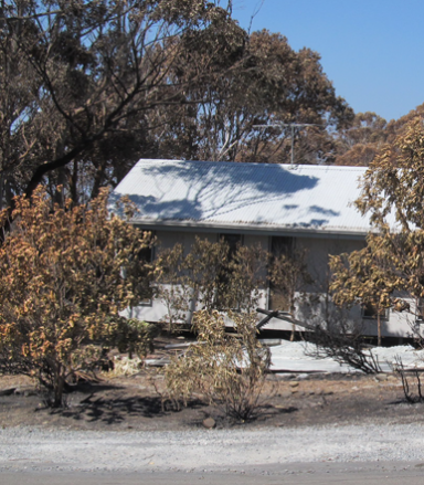 Home damaged by bushfire