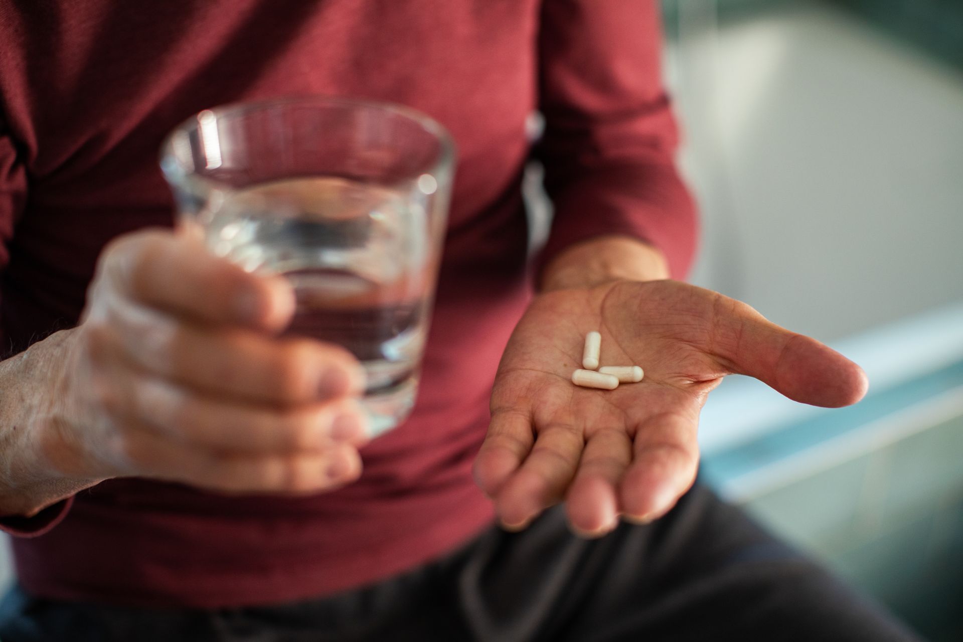 Person holding pills