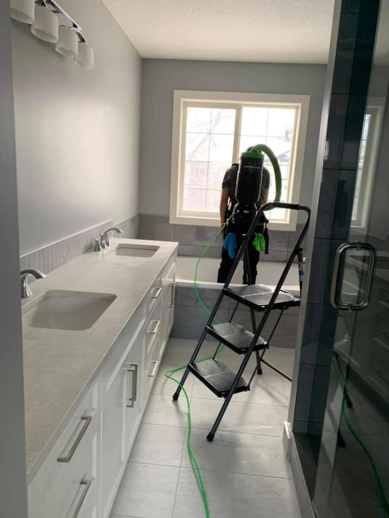 Professional residential bathroom deep cleaning in progress
